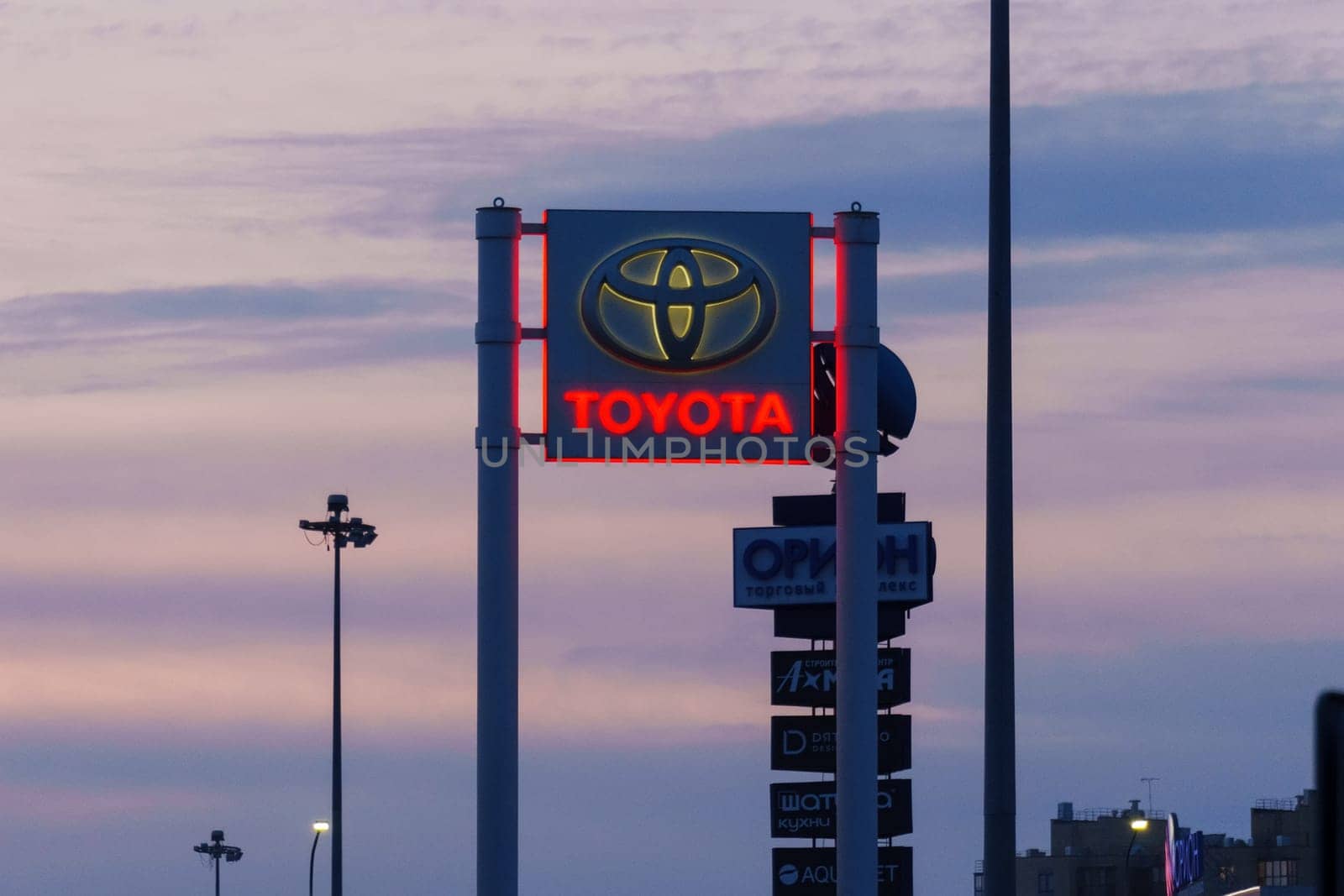 Tyumen, Russia-March 18, 2024: Toyota sign standing prominently against a clear blue sky, showcasing the iconic brand logo