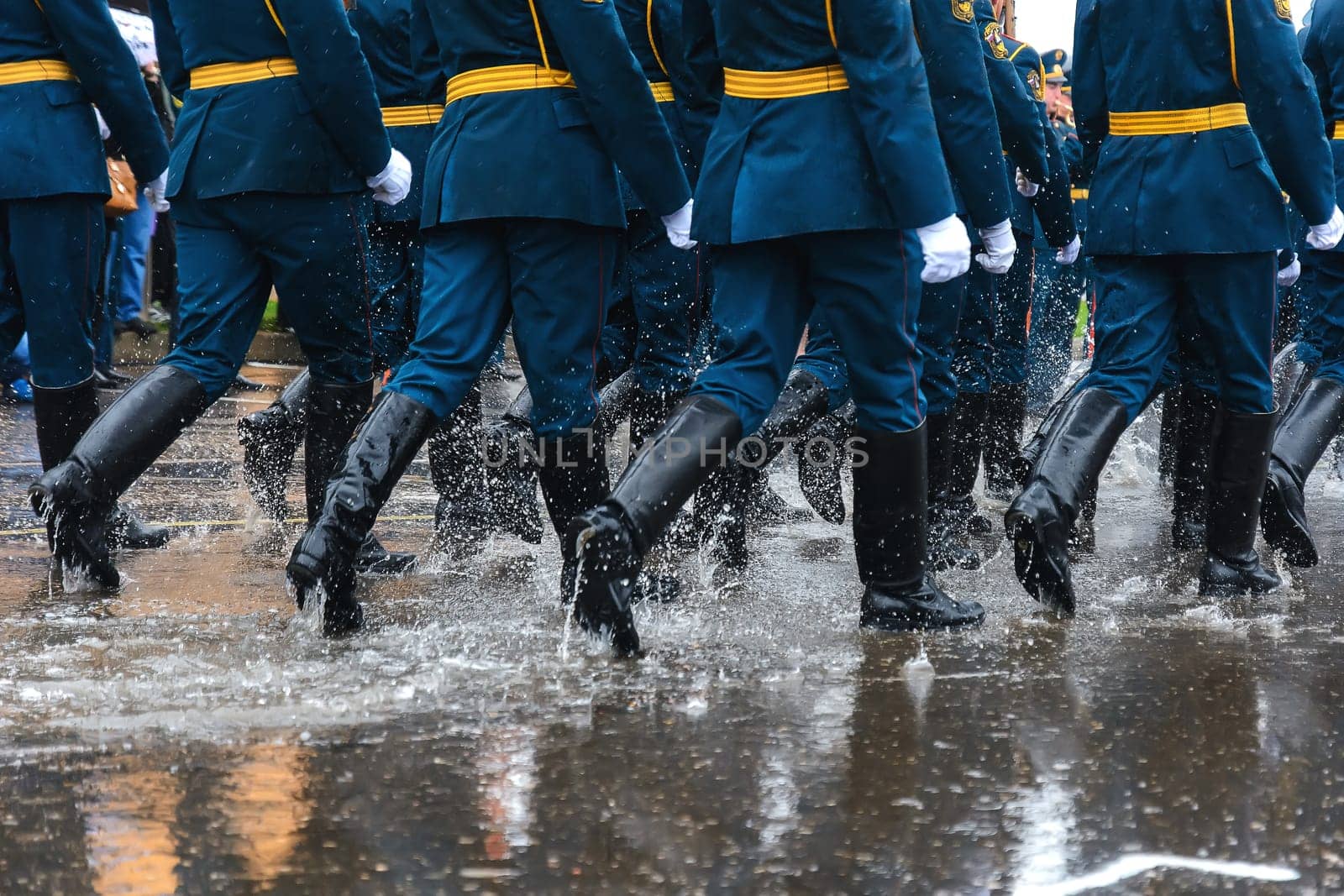 feet of the Russian military in boots marching on the festive march