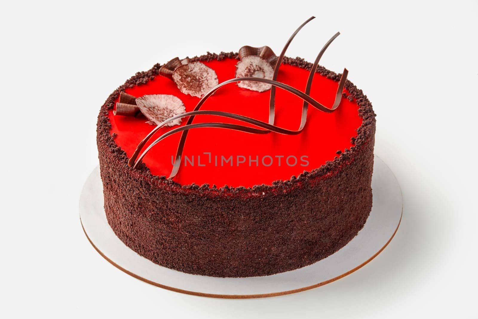 Cake with red glaze and decorative chocolate shavings by nazarovsergey