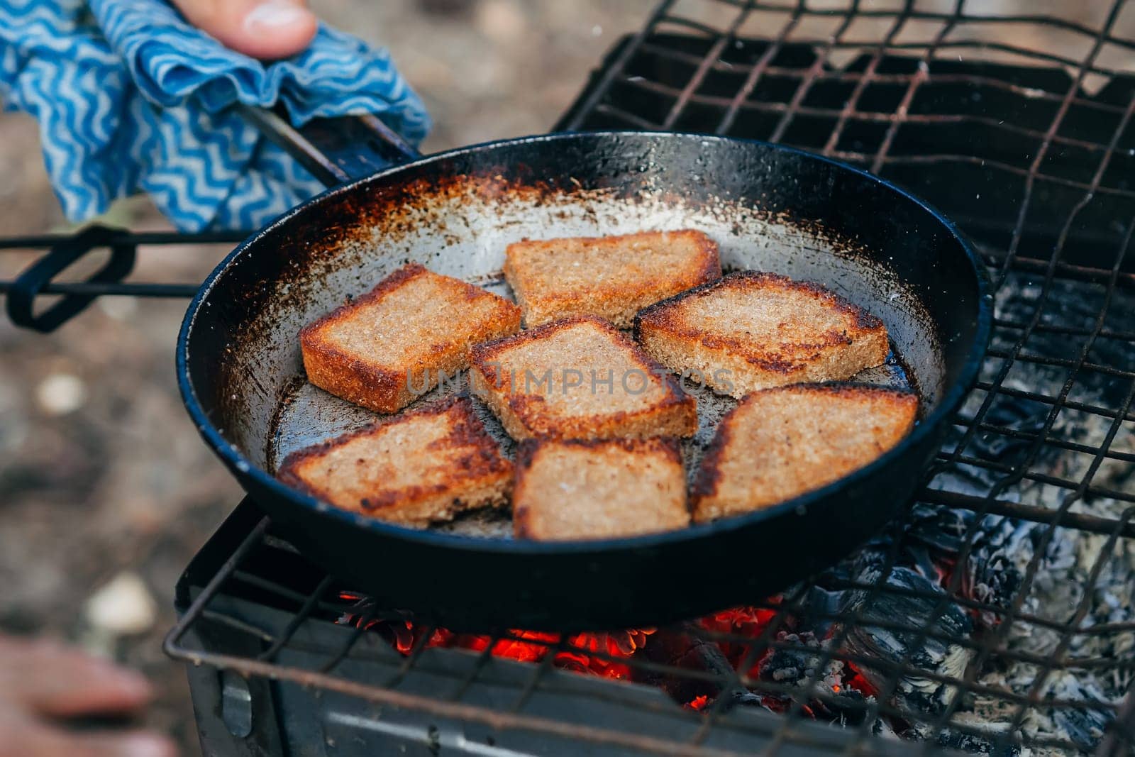 toast bread roasting on the fire camping in the nature