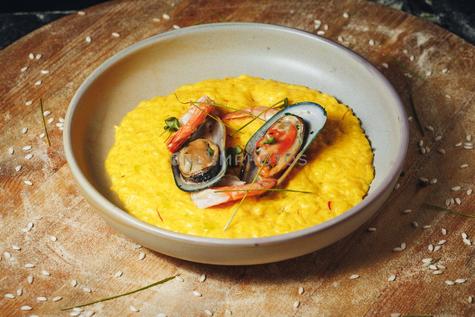 Sun-Kissed Seafood Symphony A vibrant bowl filled with golden risotto by Miron