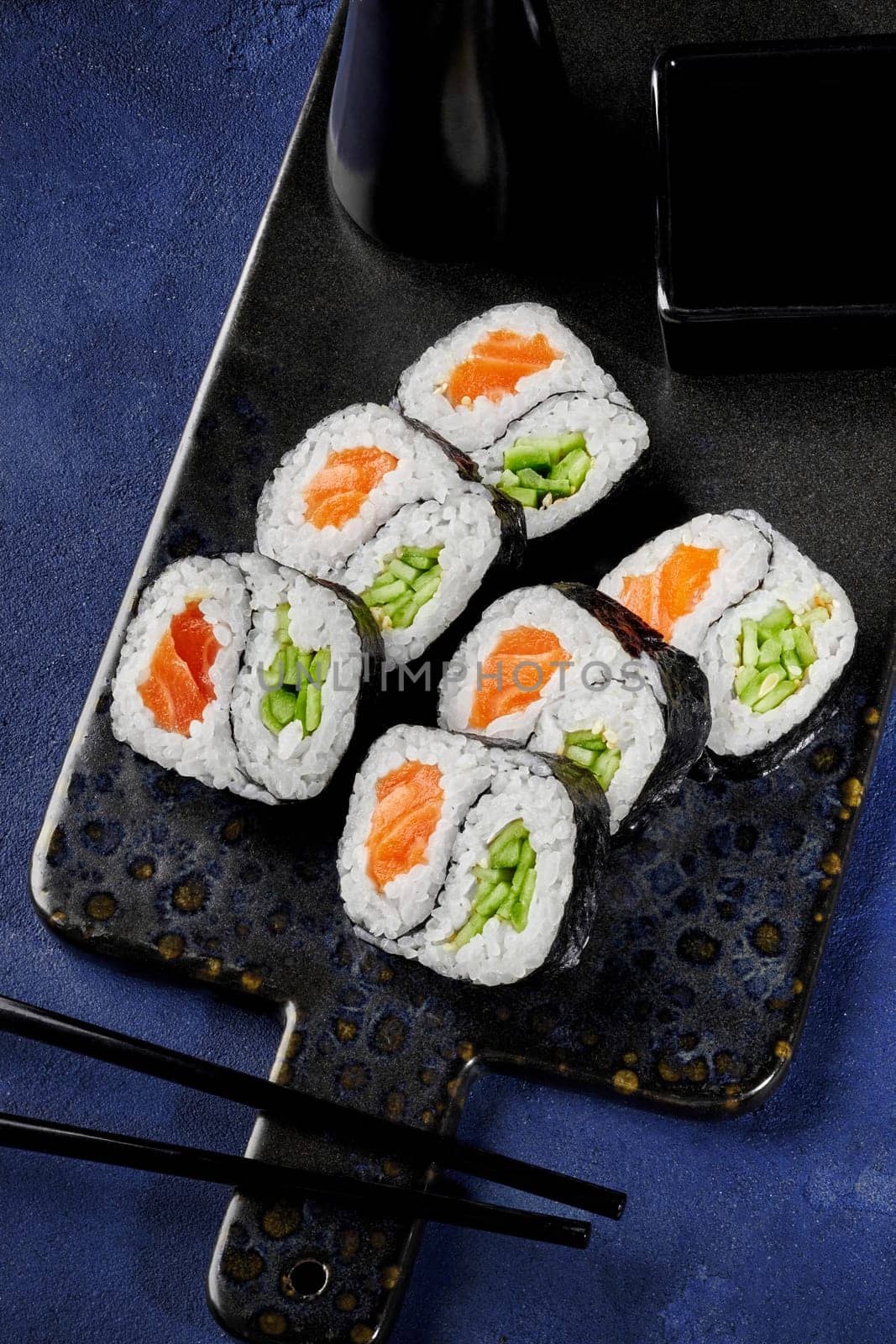 Salmon and cucumber futomaki rolls with yin-yang design by nazarovsergey