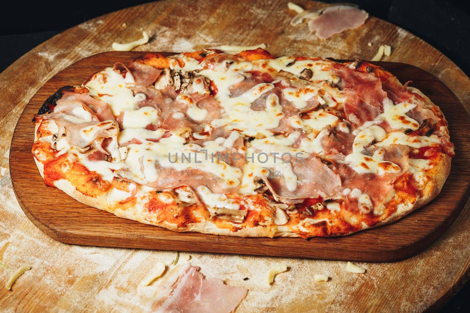 Delectable Ham and Cheese Pizza on Wooden Board by Miron