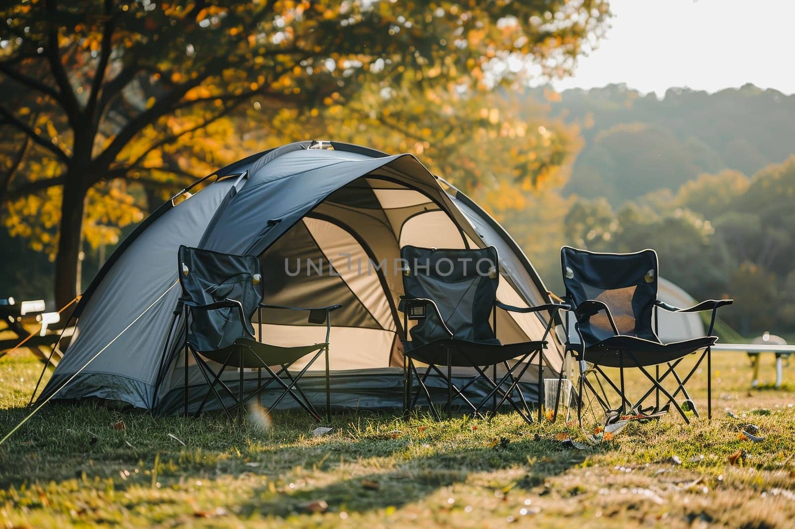 Camping outdoors with lots of sunlight. tent, chairs, a tent BBQ rack, and more.