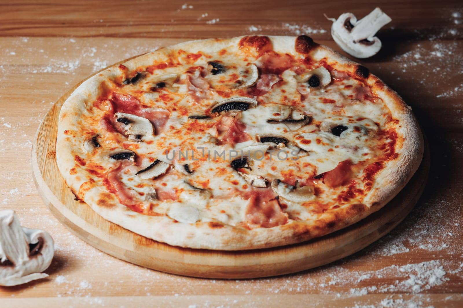 A freshly baked pizza with bubbling cheese, sitting enticingly on a weathered wooden table.