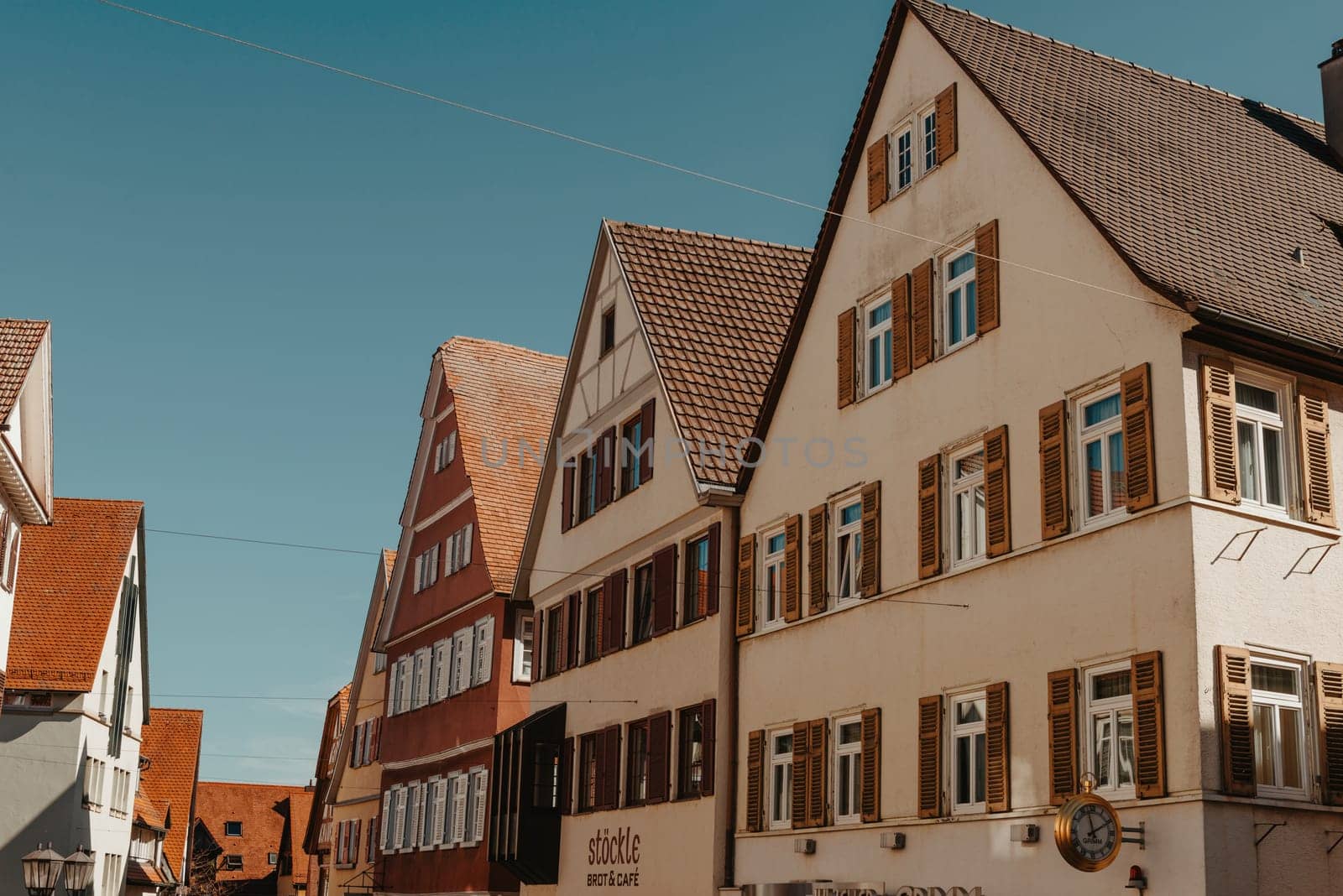 Old national German town house. Old Town is full of colorful and well preserved buildings. Baden-Wurttemberg is a state in southwest Germany bordering France and Switzerland. The Black Forest, known for its evergreen scenery and traditional villages, lies in the mountainous southwest. Stuttgart, the capital, is home to Wilhelma, a royal estate turned zoo and gardens. Porsche and Mercedes-Benz have headquarters and museums there. The 19th-century Hohenzollern Castle sits in the Swabian Alps to the south.