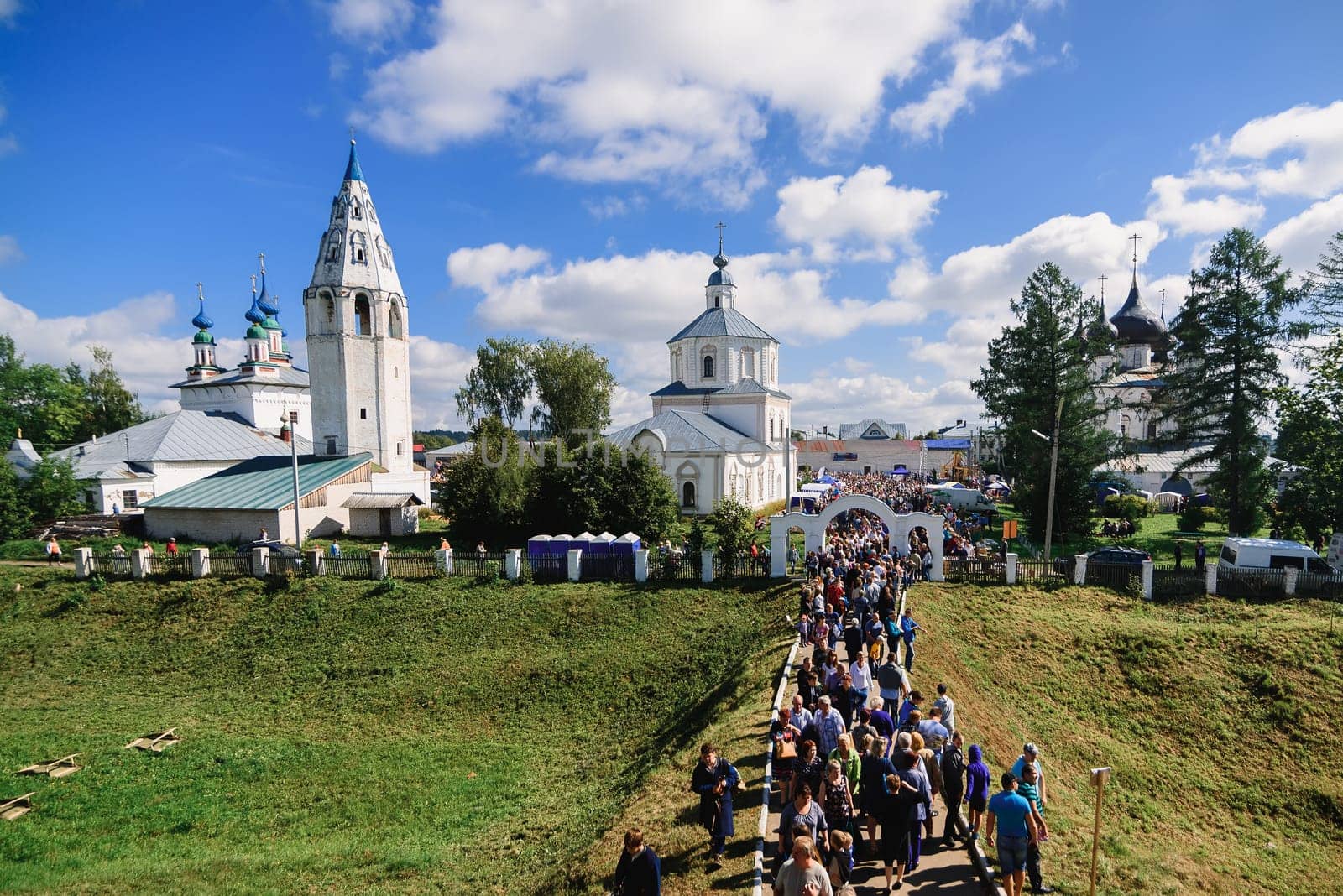 LUH, RUSSIA - AUGUST 27, 2016: Temple ensemble of the village of Luh with tourists on the holiday of Onion day, Russia