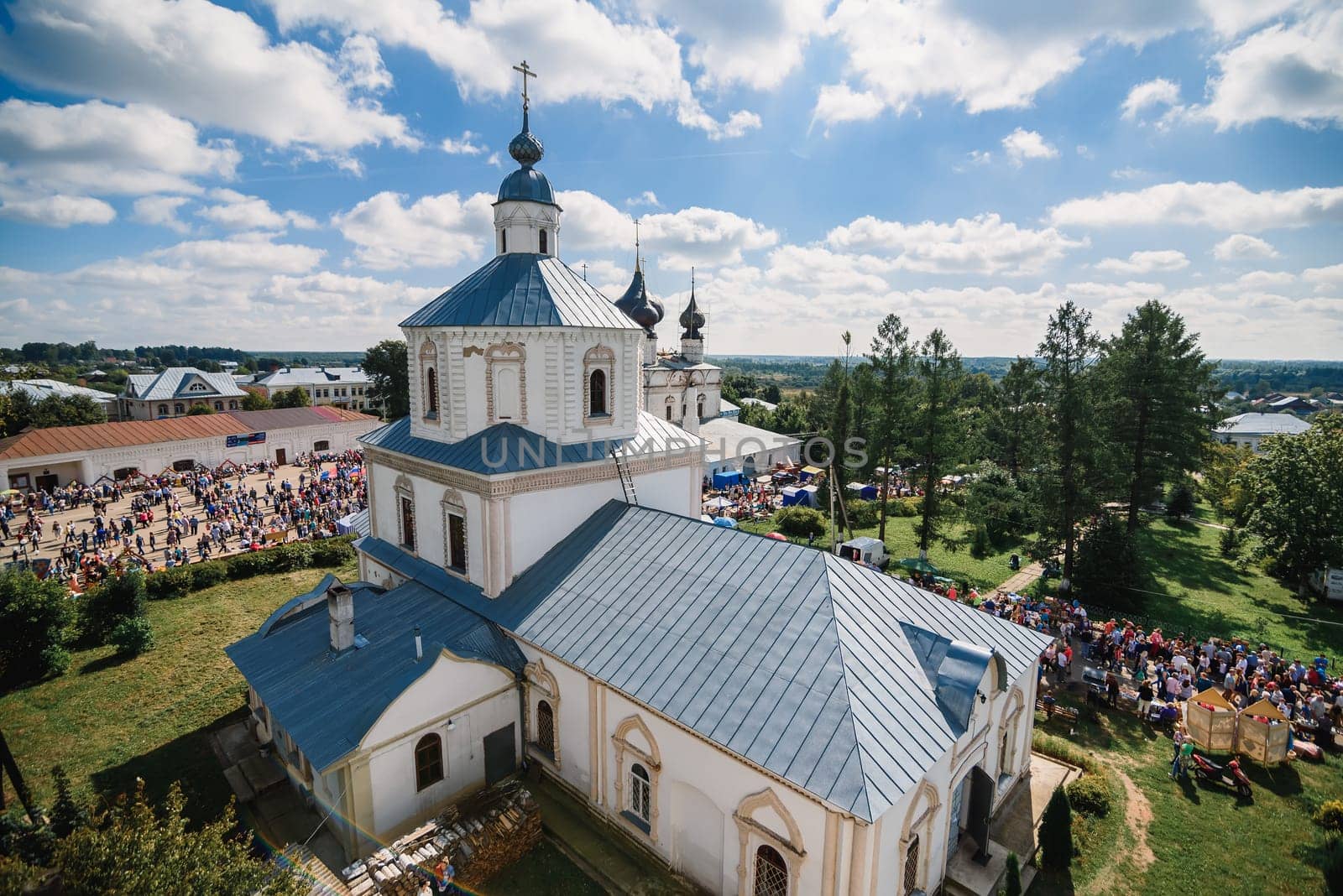 LUH, RUSSIA - AUGUST 27, 2016: Temple ensemble of the village of Luh with tourists on the holiday of Onion day, Russia