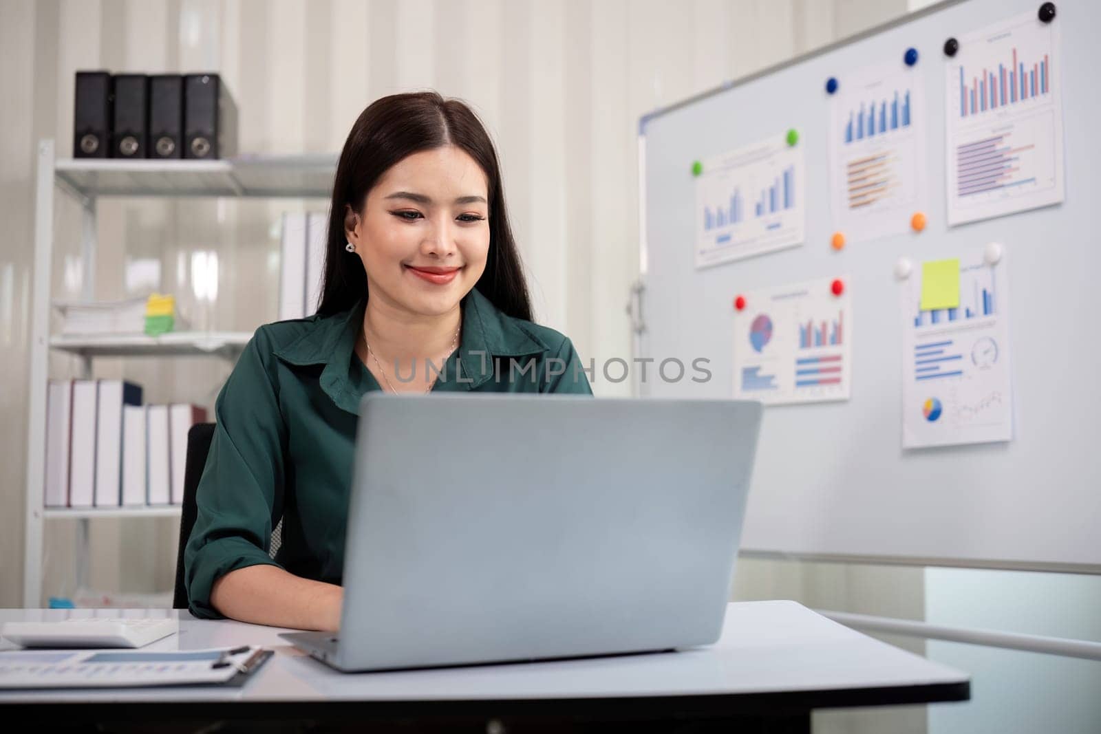 Business accounting woman counting on calculator working on financial document in hands closeup. Bookkeeping concept.