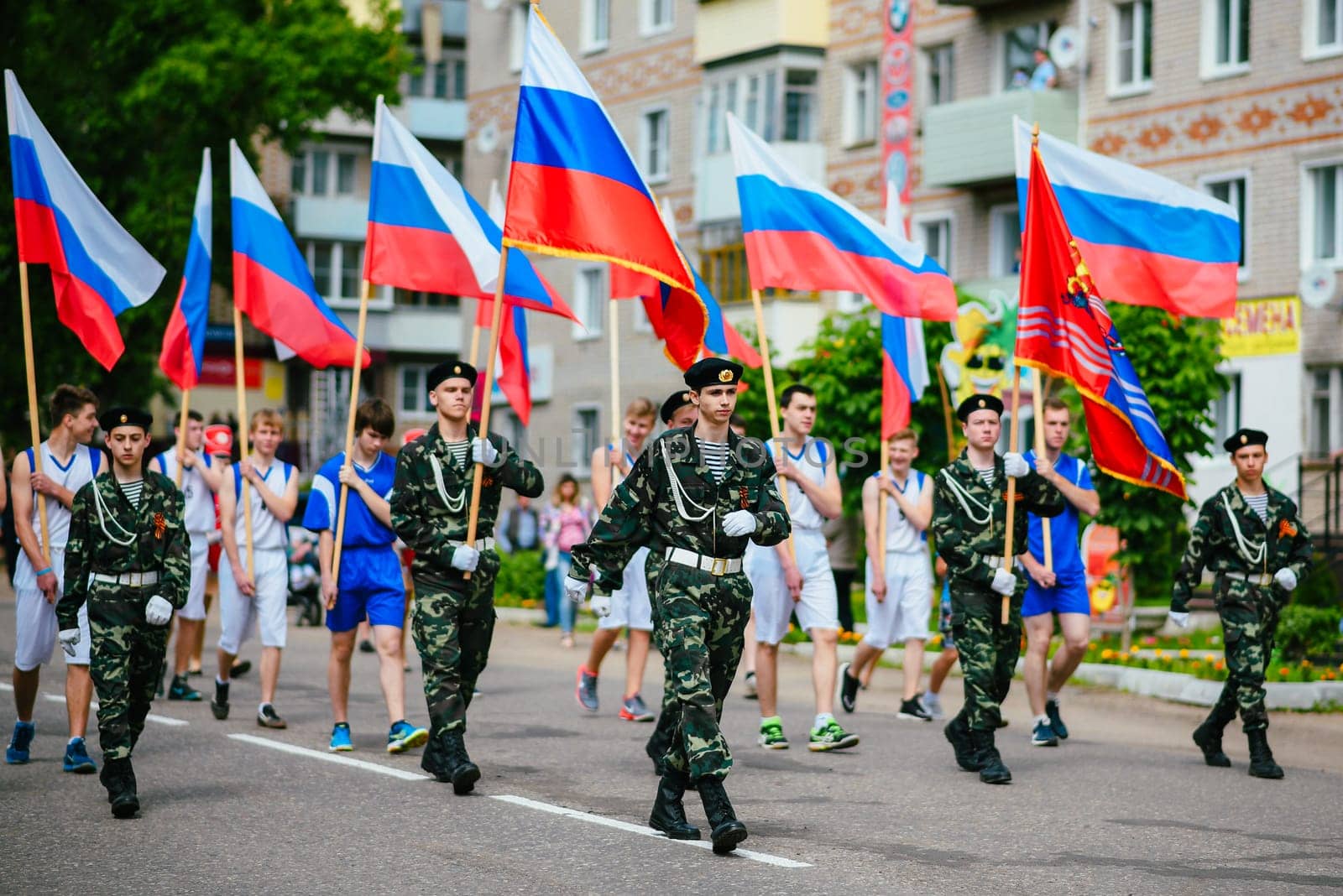 VICHUGA, RUSSIA - JUNE 24, 2017: Festive procession of people on the street on the Day of Vichuga, Russia