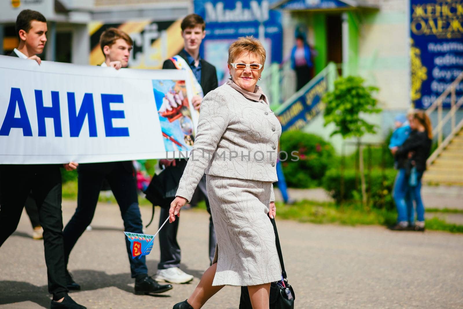 VICHUGA, RUSSIA - JUNE 24, 2017: Festive procession of people on the street on the Day of Vichuga, Russia
