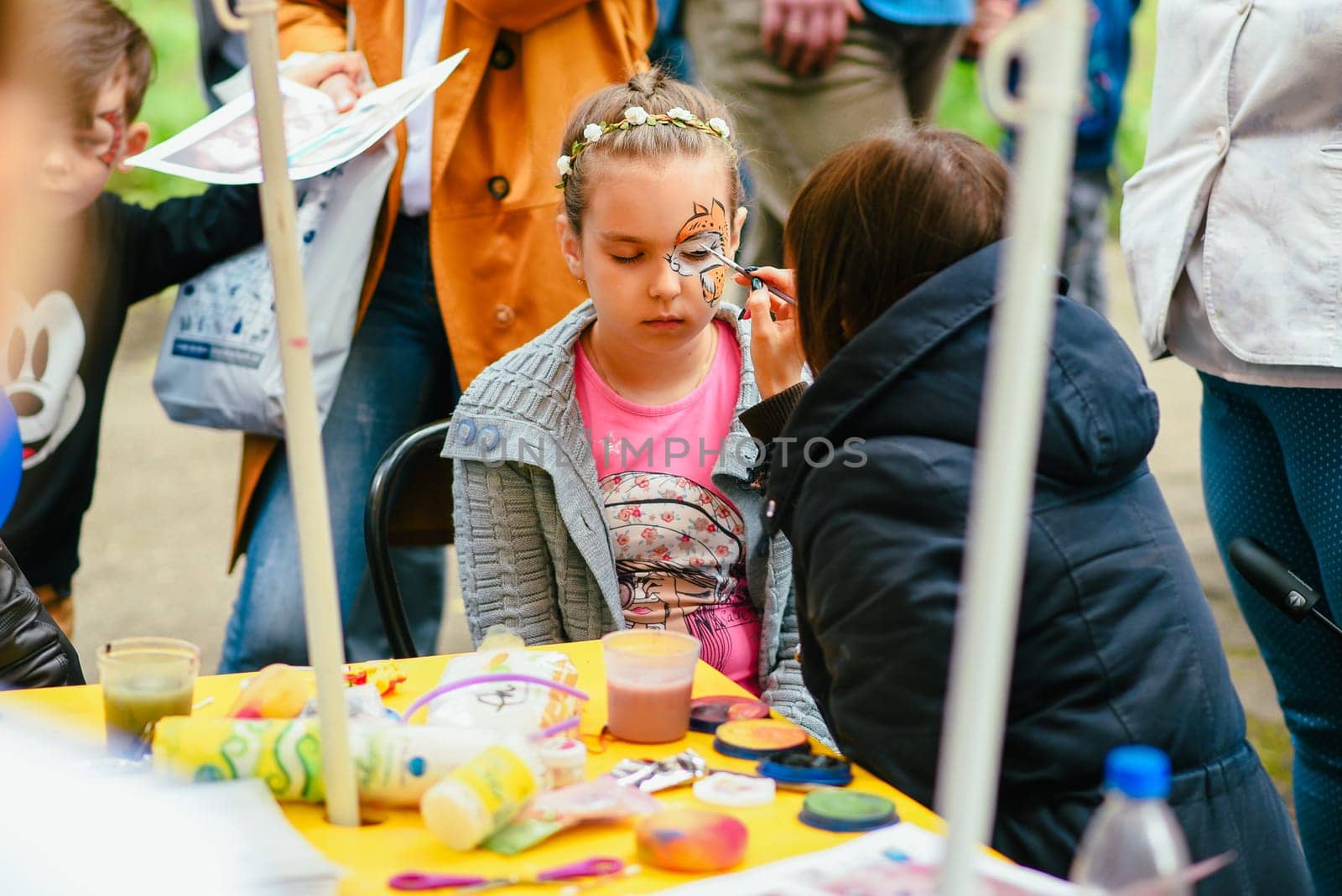 VICHUGA, RUSSIA - JUNE 24, 2017: Body art on the face of the girl celebration of the day of Vichuga, Russia