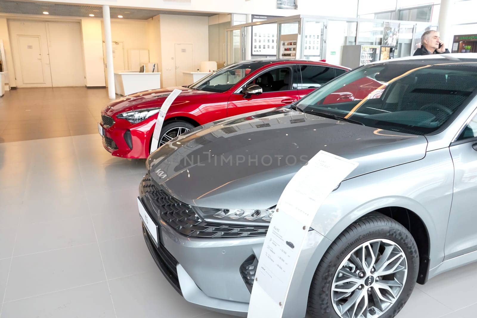 Kazan, Russia - November 25, 2022: Cars in showroom of dealership Kia in Kazan in country Russia. Partial focus by keleny
