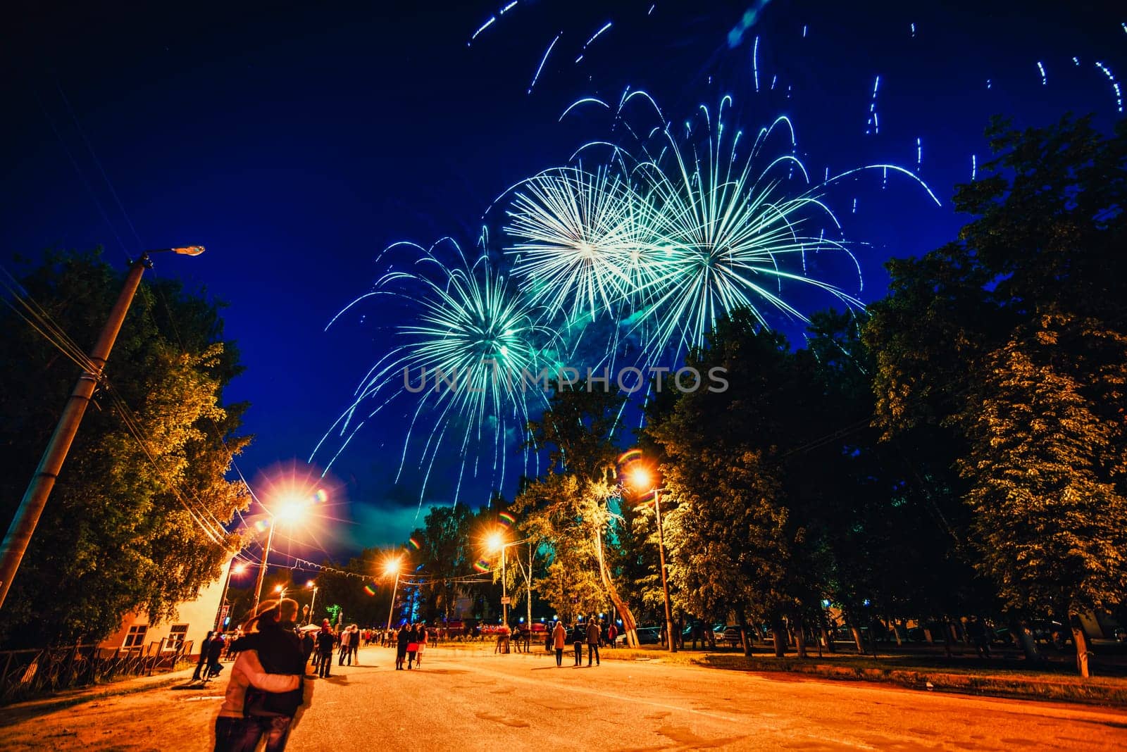 VICHUGA, RUSSIA - JUNE 24, 2017: Festive fireworks and a crowd of people at the Festival of the Day of Vichuga. Russia