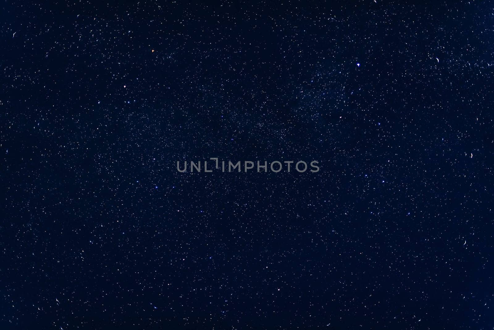 background with a starry dark blue sky and the milky way