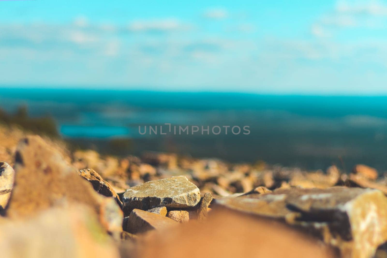 view from the mountain, stones in the foreground and perspective, disasters