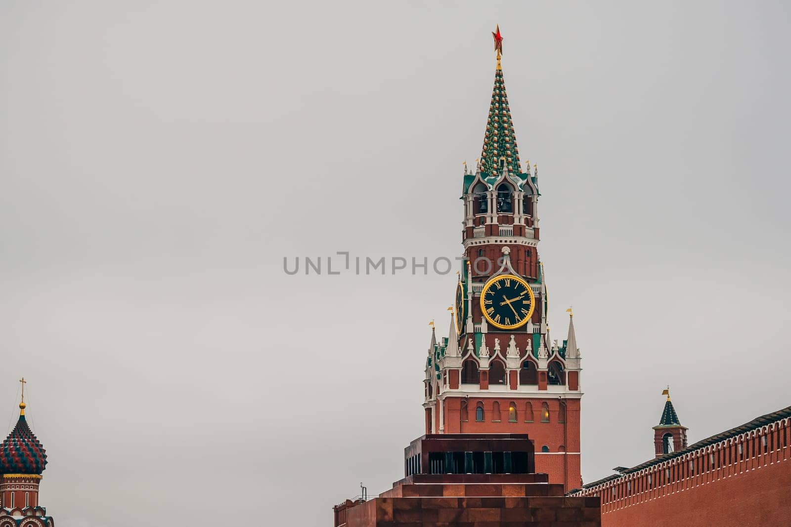 clock on the Spasskaya tower in red square in Moscow, Russia