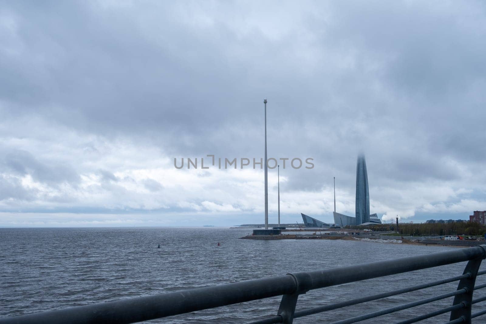 Saint-Petersburg, Russia. - May 10, 2024 View of the modern high-rise building of the Lakhta Center complex against the backdrop of a dramatic sky. Selective focus.