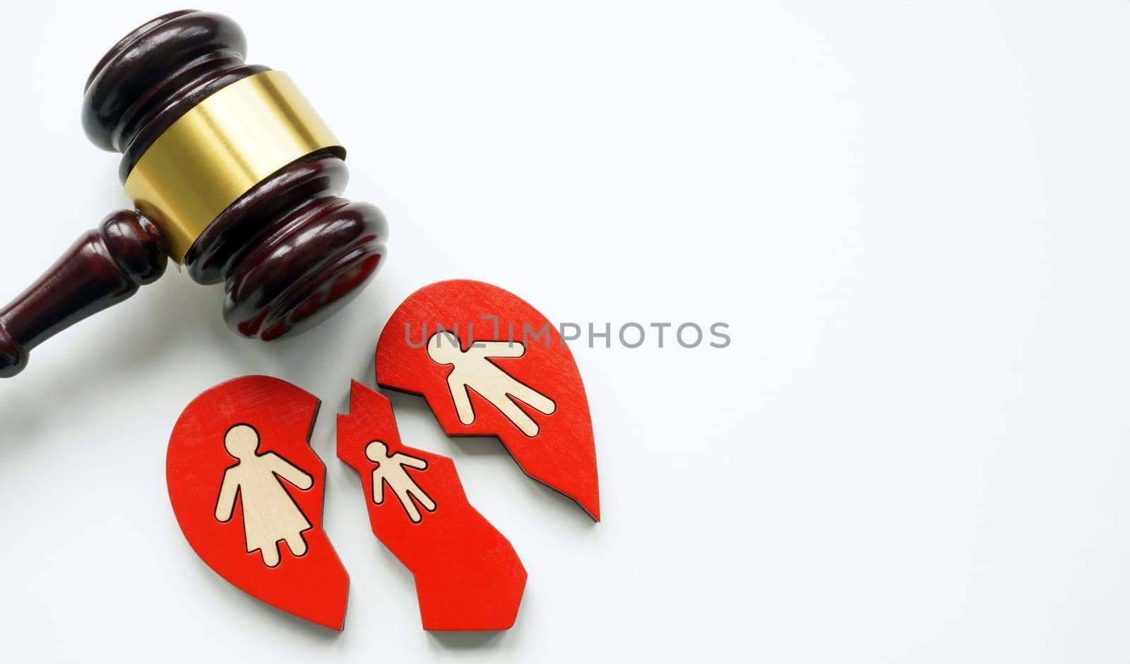 Broken heart with family as a divorce concept and a gavel symbolizing the law. by designer491