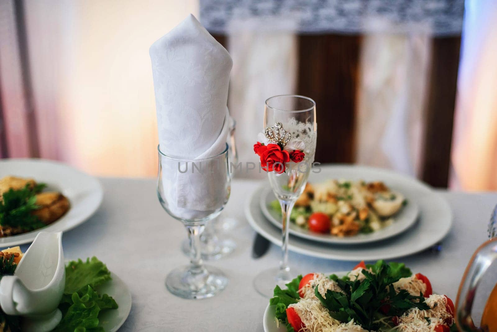 beautifully decorated glasses on the festive table for wedding
