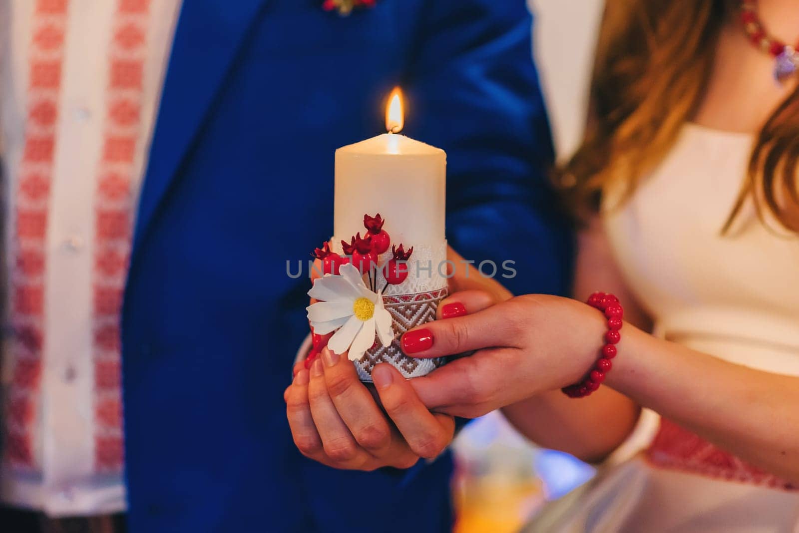 bride and groom holding a candle. Wedding religious Christian tradition
