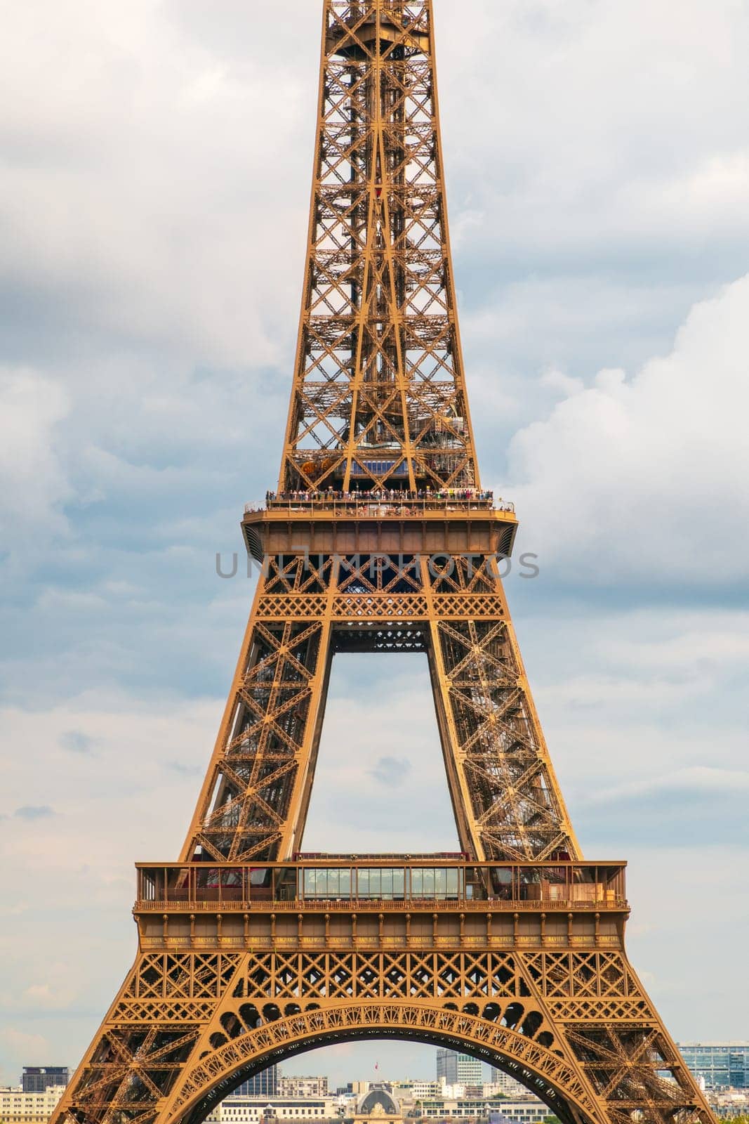 Paris, France - August 29 2023: The Eiffel tower seen from Trocadero in a cloudy day. Vertical photography taken in Paris