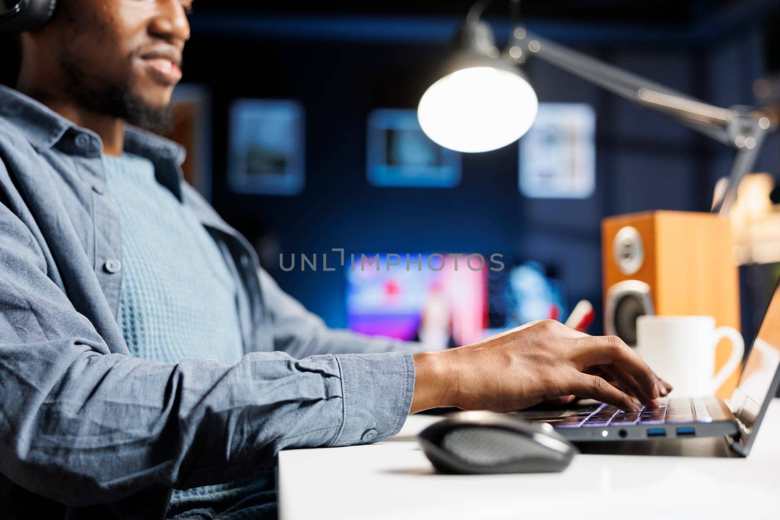 Business employee working on monthly revenue balance with legal banking information and online reports, remote tasks. African american man solving his accounting duties. Close up.