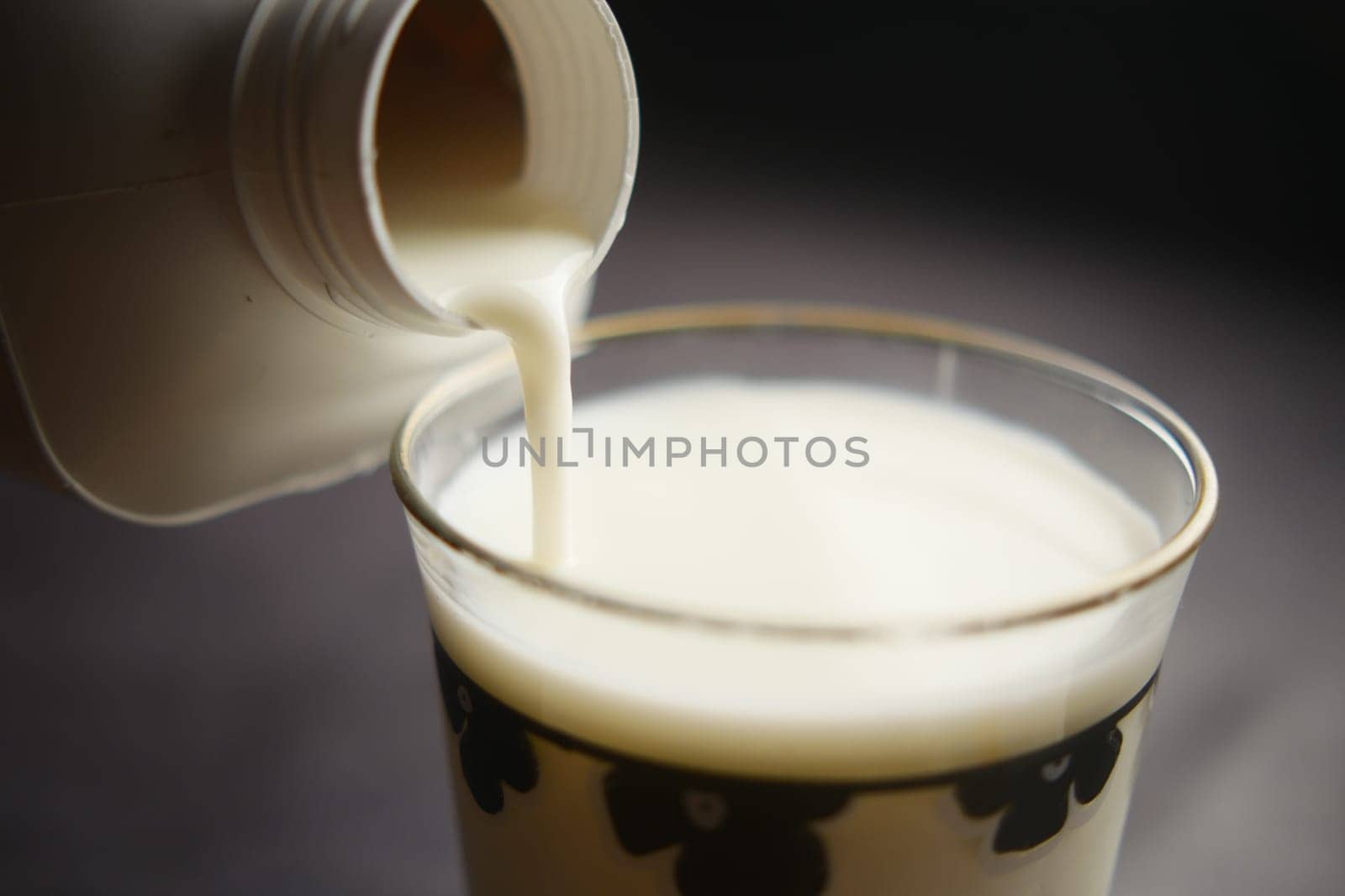 slow motion of pouring milk from a container close up by towfiq007