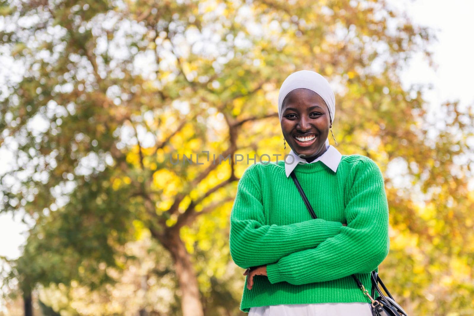 black woman laughing happy looking at camera by raulmelldo