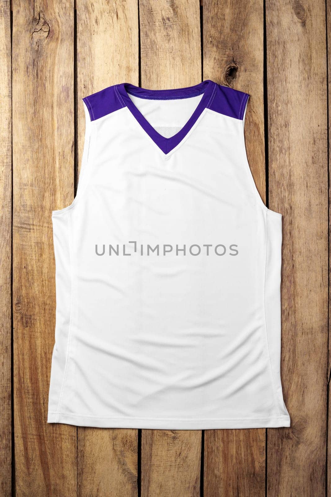 Basketball uniform on wooden background top view by Fabrikasimf