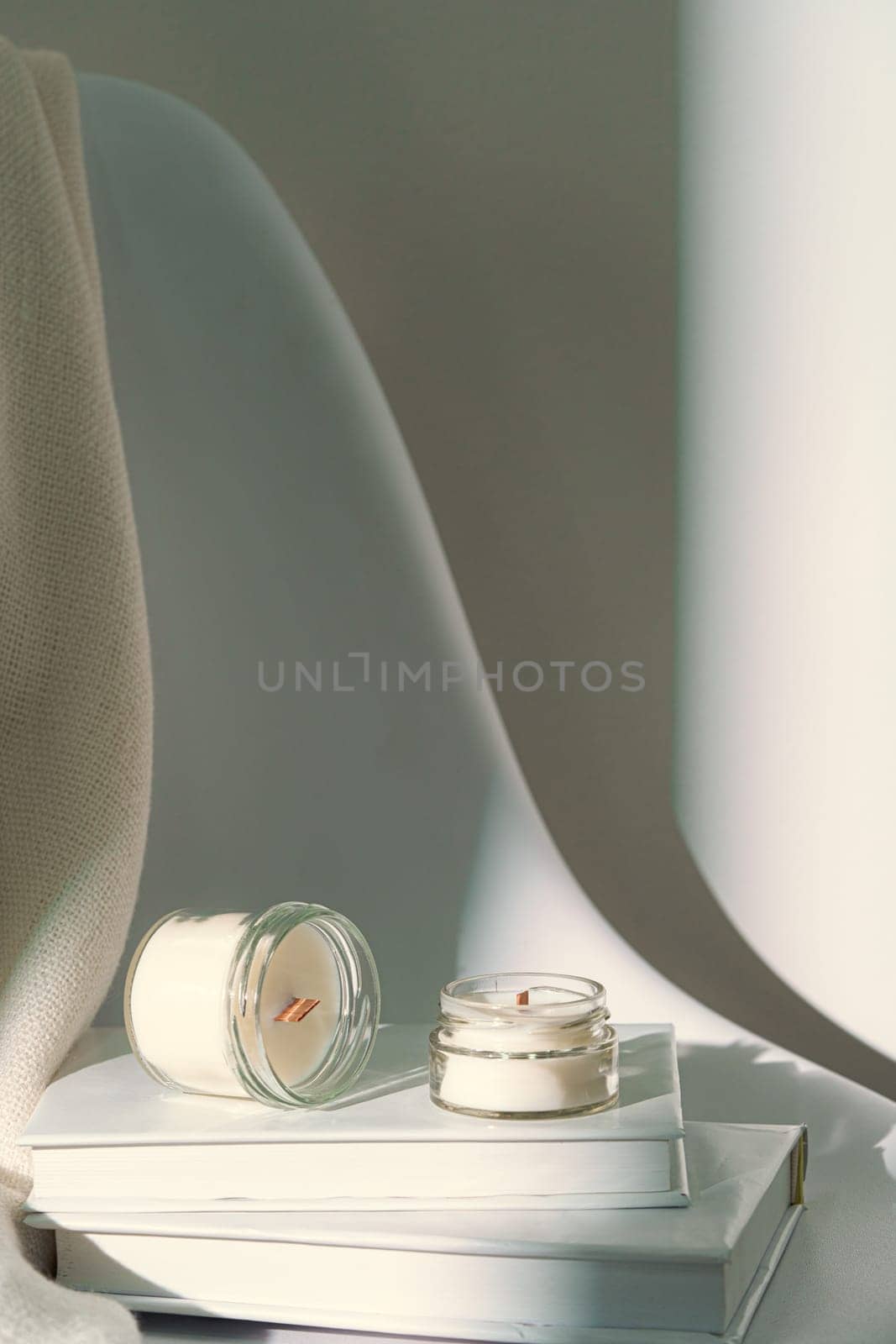 Aromatic candle in glass jar close up by Fabrikasimf