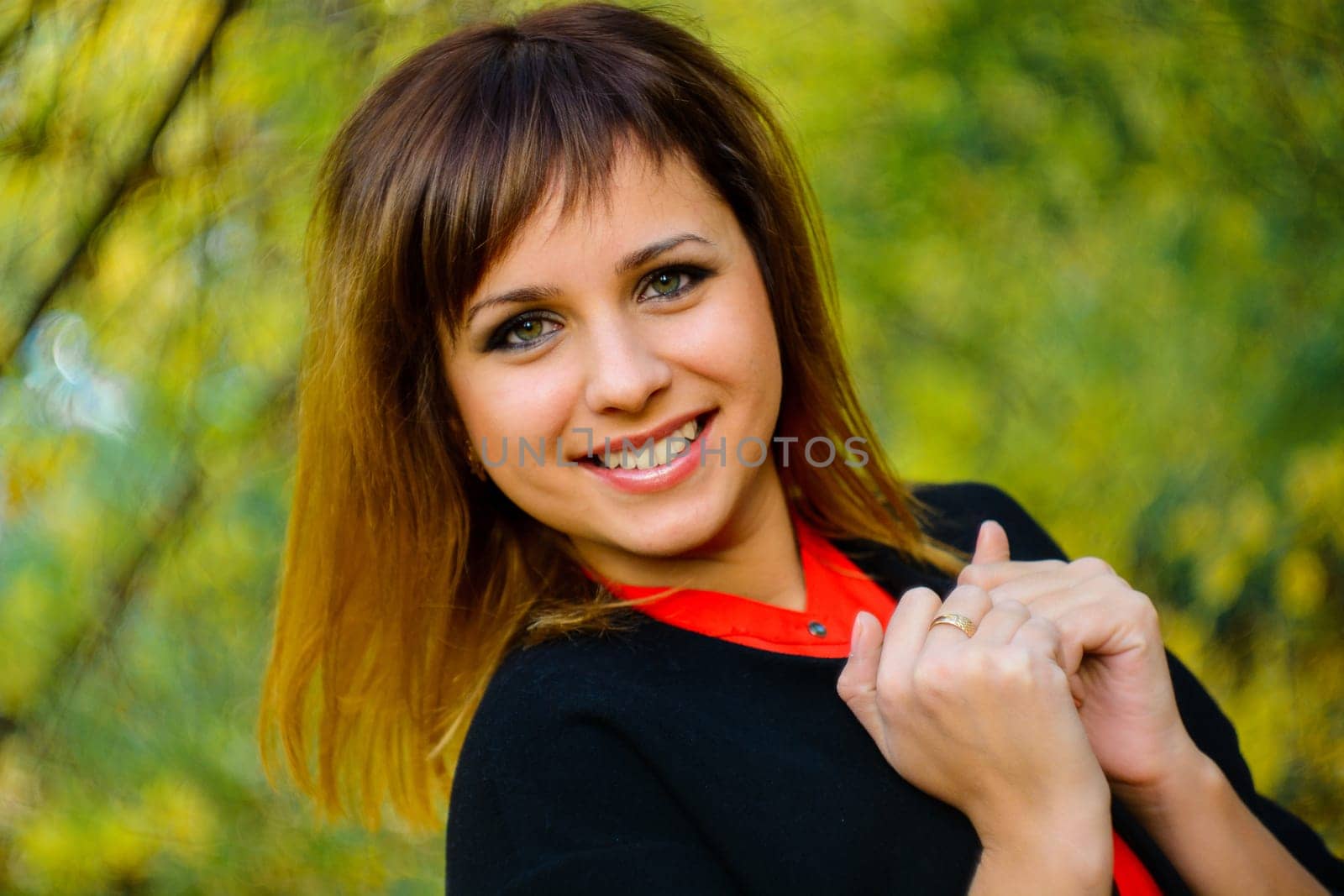 portrait of girl Caucasian appearance smiling in the forest in autumn