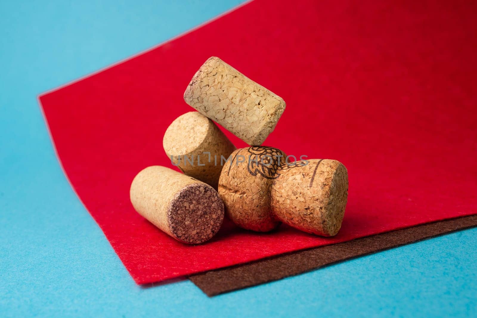 wine corks close-up on a red and blue background.