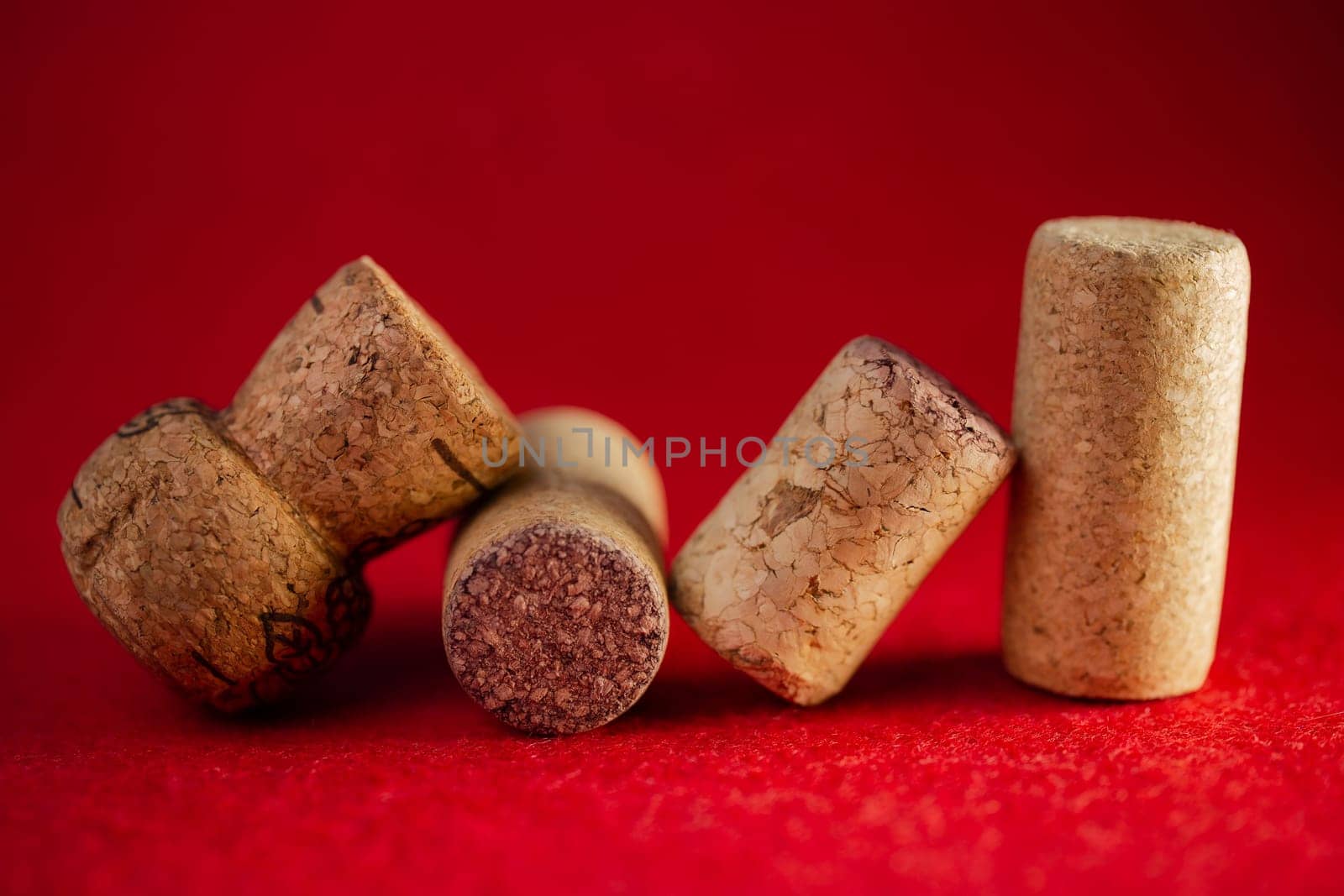 wine corks close-up on a red background.
