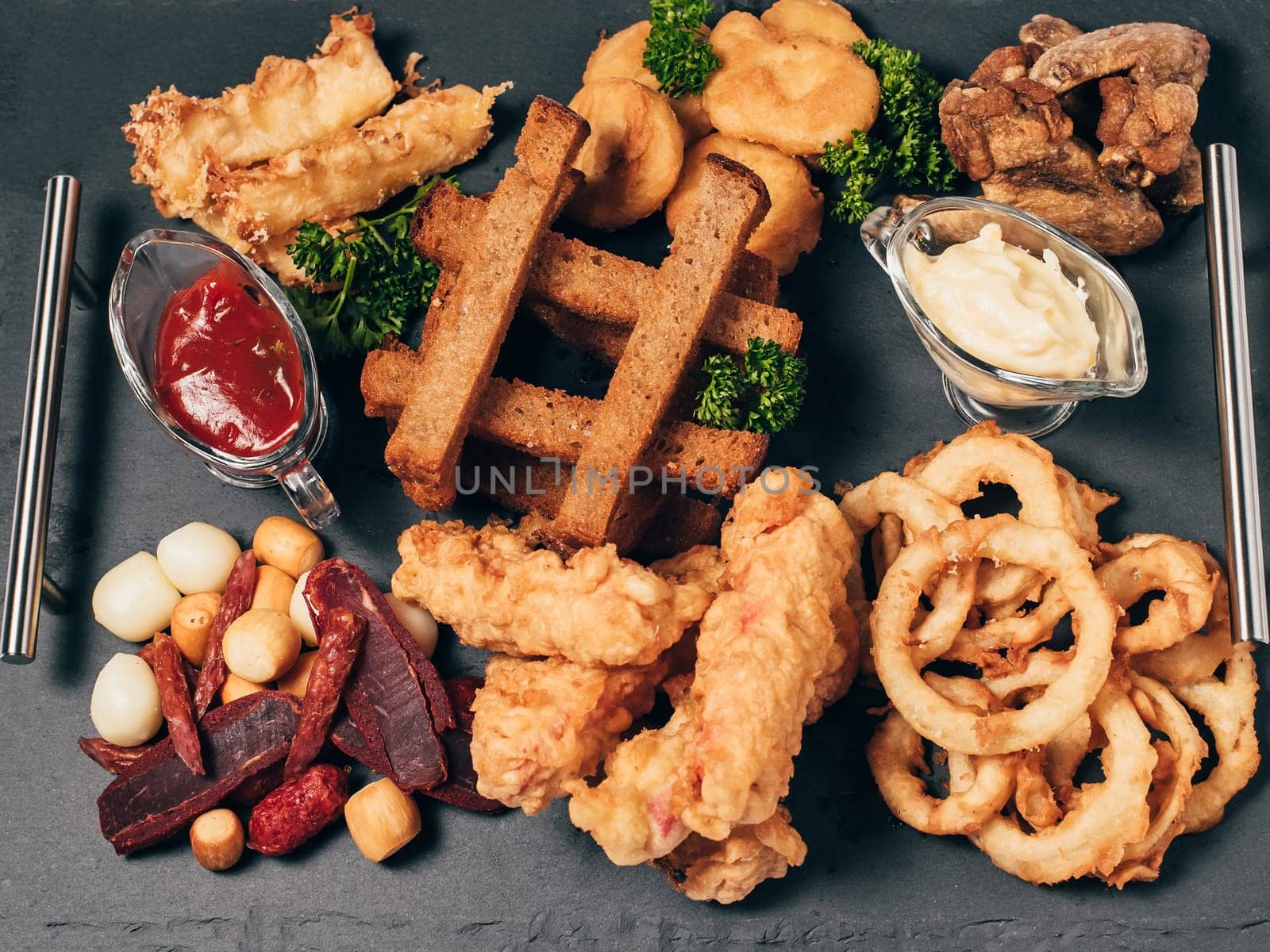 beer snacks with sausage, cheese, breadcrumbs and breaded sauce
