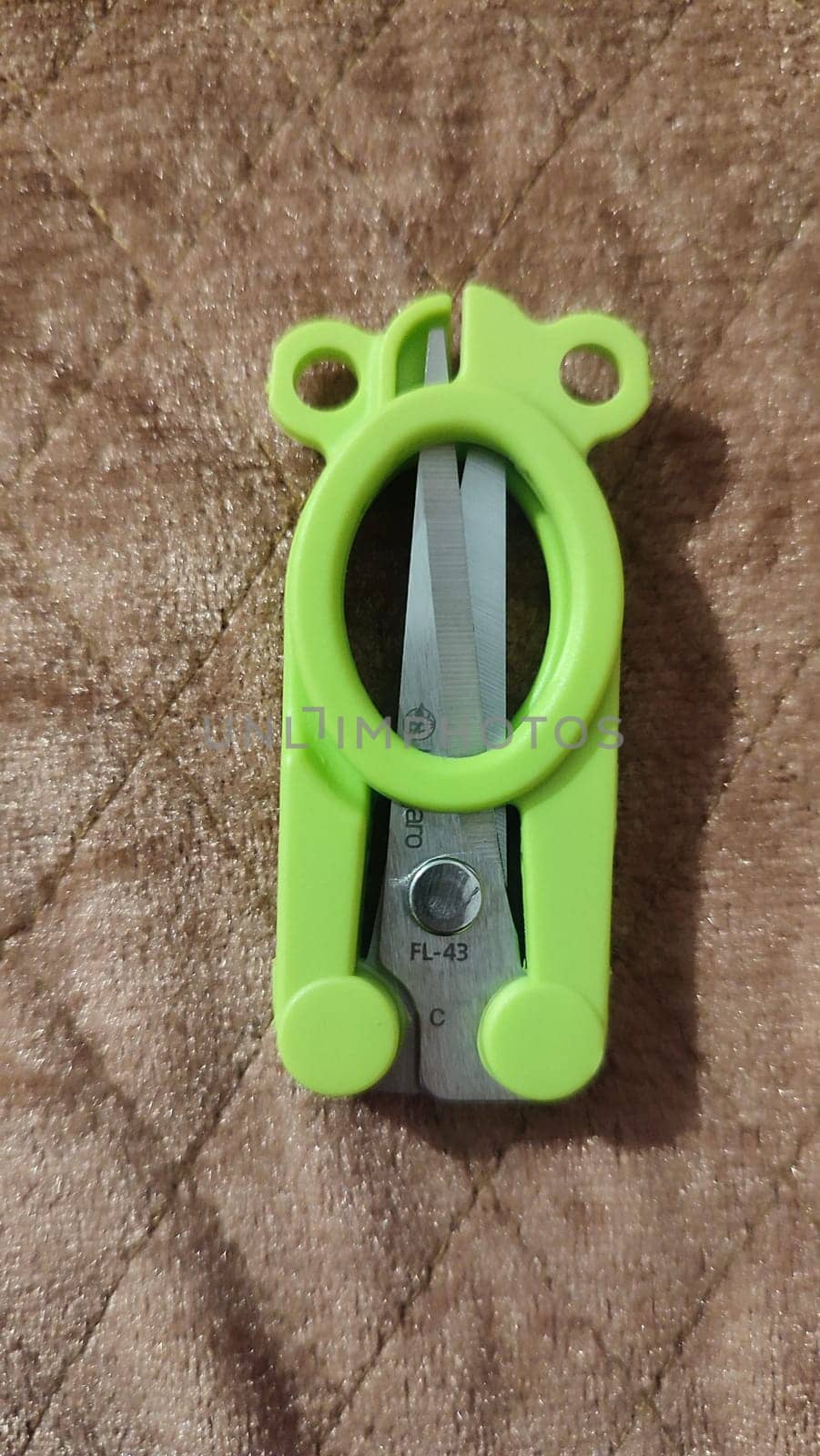 18 April 2024: Beer-Sheva Israel small folding travel scissors object. High quality photo