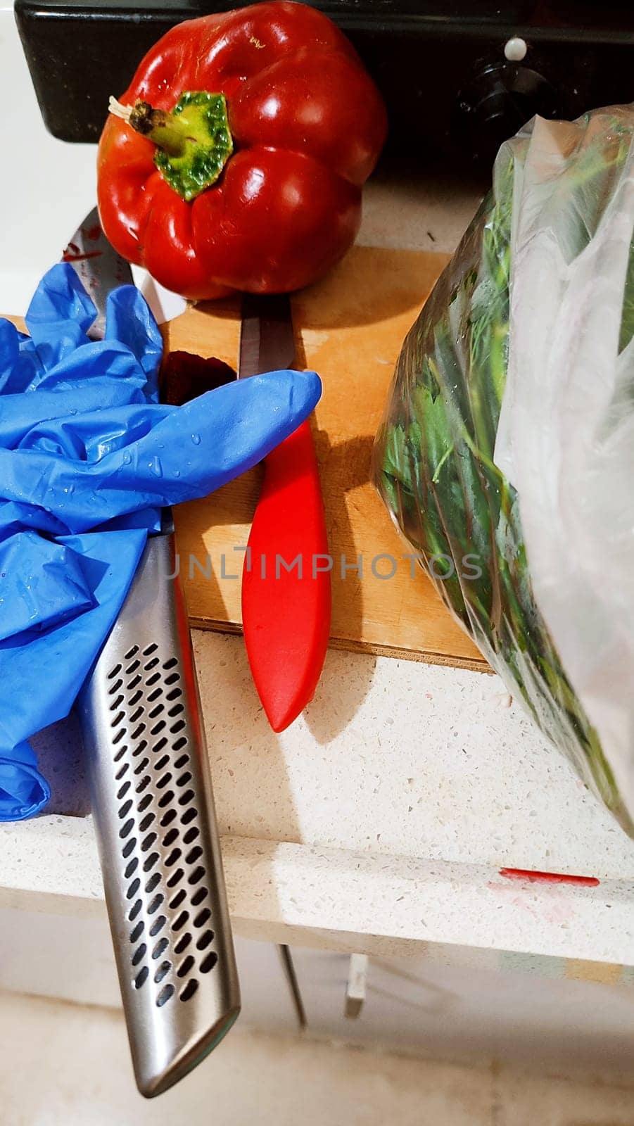 kitchen knives, rubber glove, red sweet bell pepper, kitchen, cooking. High quality photo