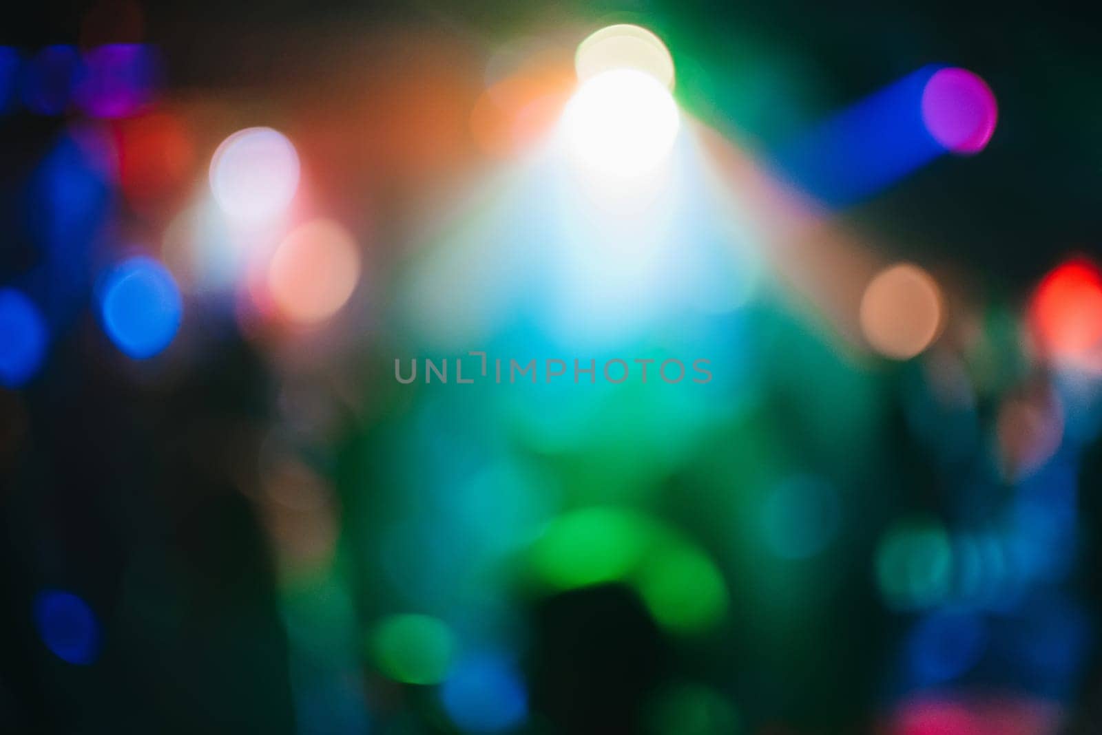 Colorful background with bokeh defocused blurred multicolored lights in a nightclub