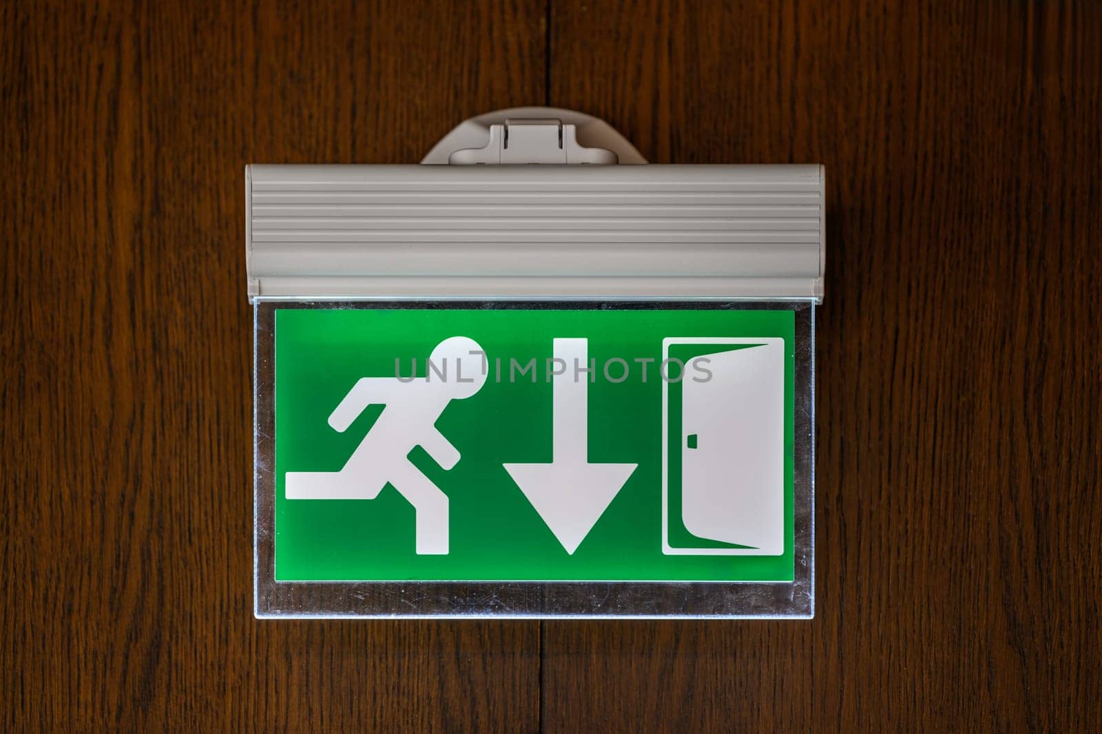 modern emergency exit sign showing emergency exit downwards