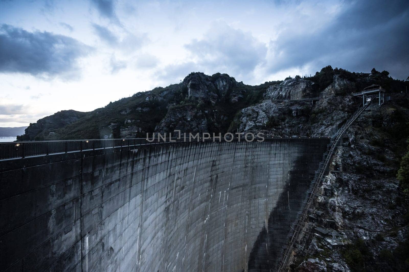 View of the Gordon Dam on a cool summer's day. It is a unique double curvature concrete arch dam with a spillway across the Gordon River near Strathgordon, South West Tasmania, Australia