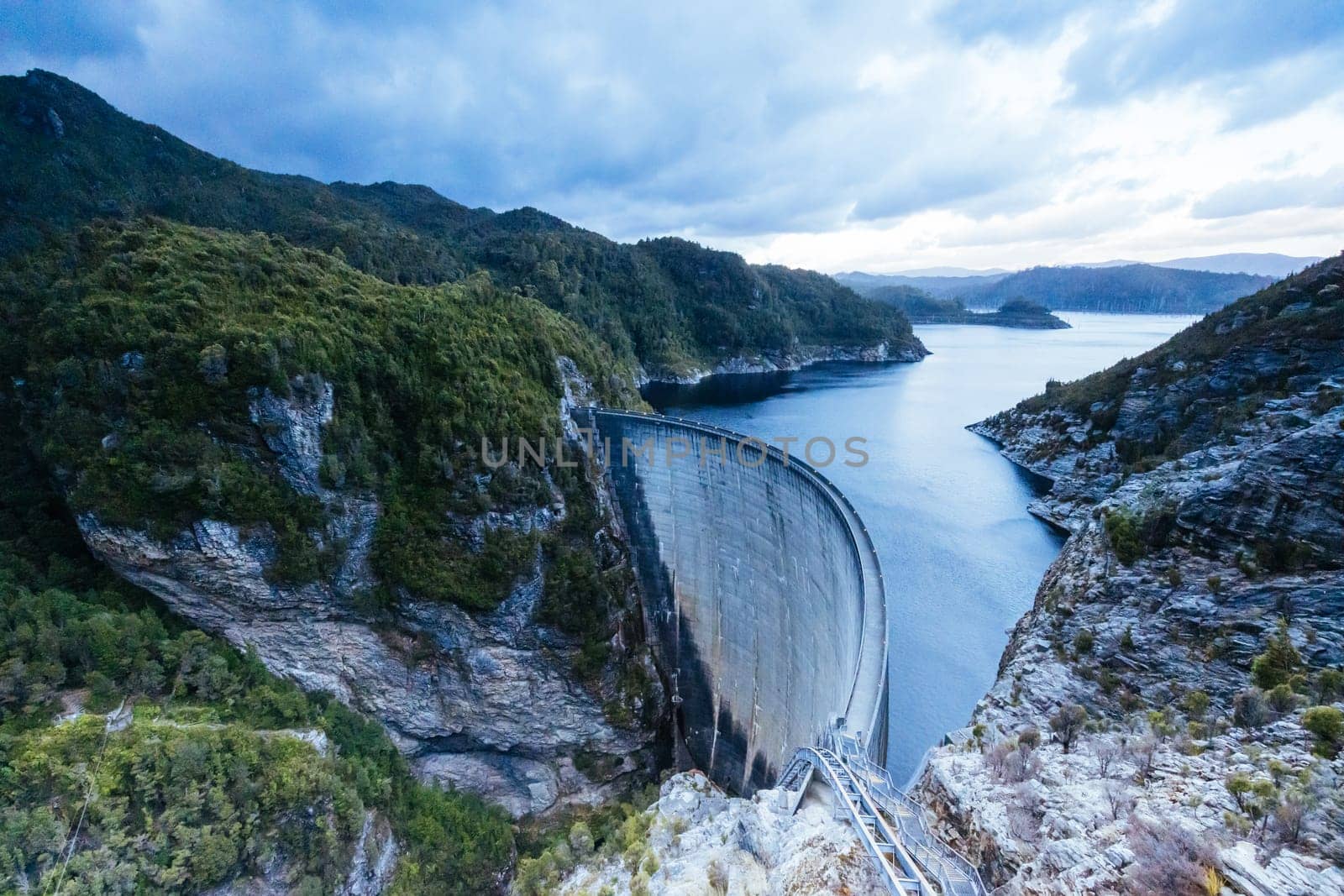 View of the Gordon Dam on a cool summer's day. It is a unique double curvature concrete arch dam with a spillway across the Gordon River near Strathgordon, South West Tasmania, Australia
