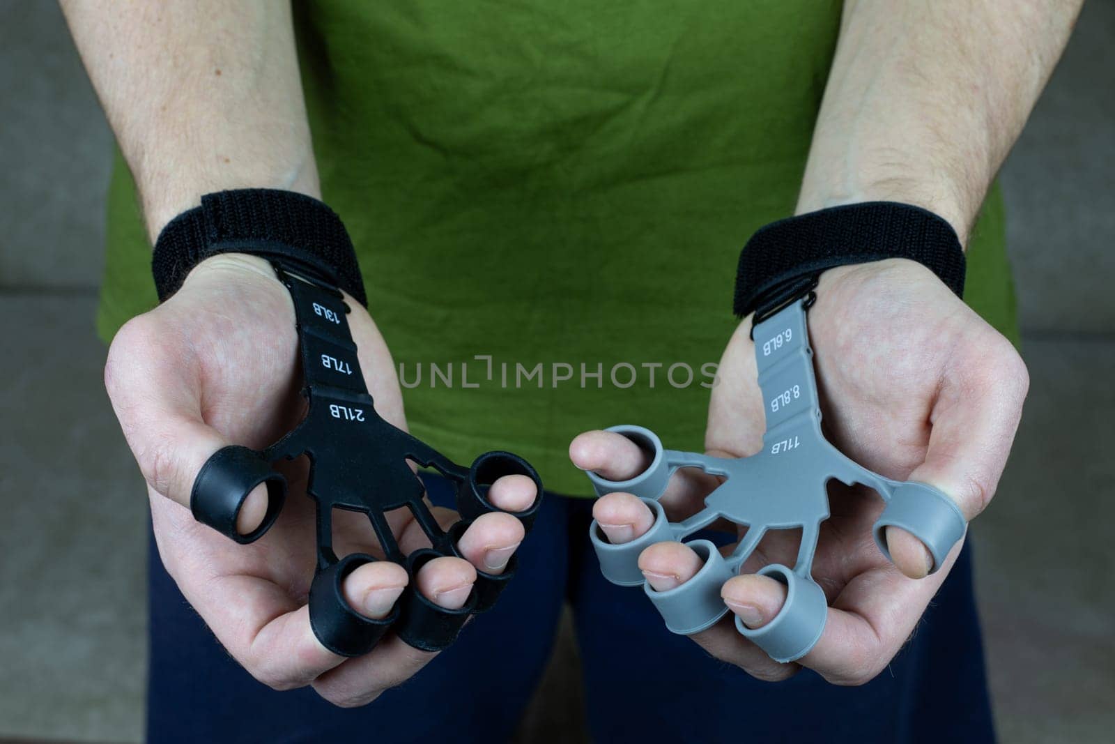 Finger trainer for two hands of man made of silicone with tension force marks for training the strength of the hands by timurmalazoniia