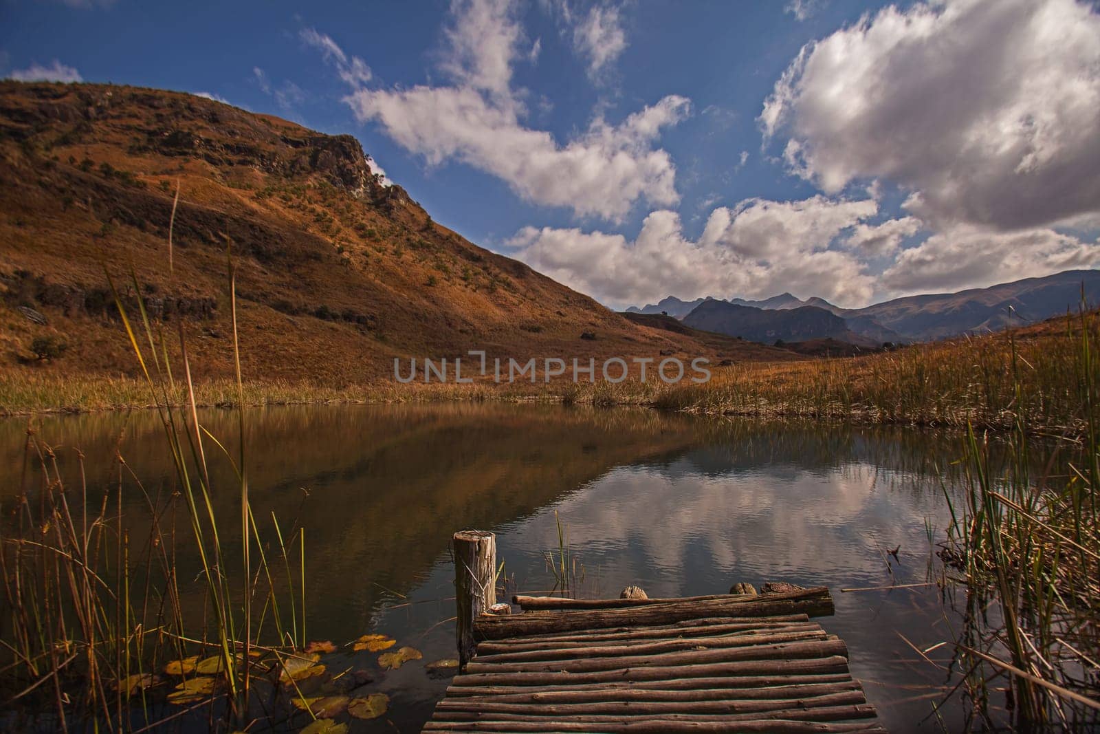 Trout dam with cloud reflections in the Cathkin Peak area of the Drakensberg Mountains South Africa