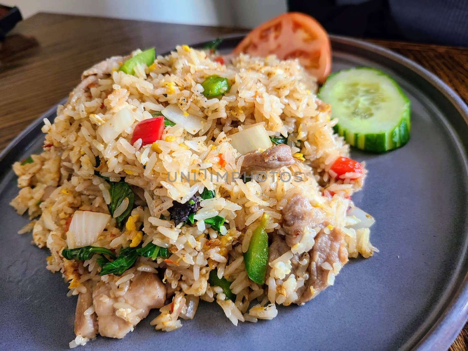 Savory Thai-inspired fried rice served in a modern setting, Fort Wayne, Indiana.