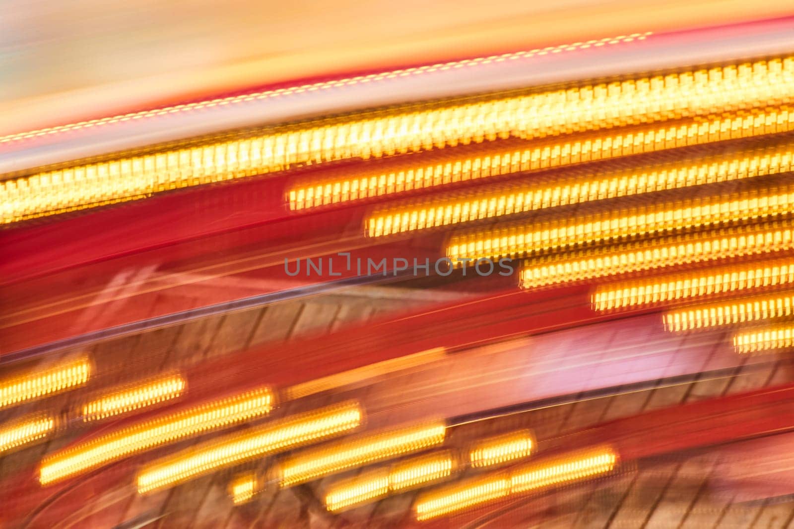 Vibrant motion blur of city lights in Fort Wayne, capturing the energetic pulse of urban nightlife.