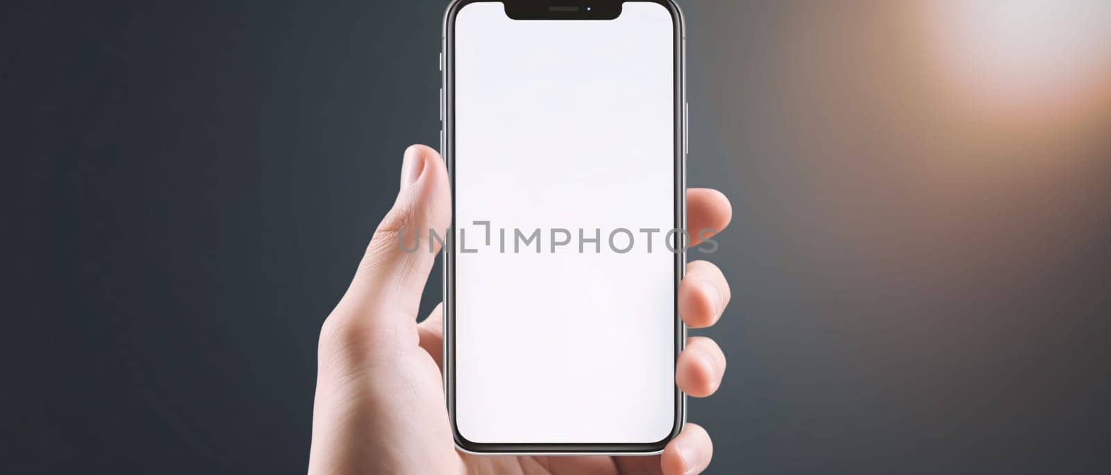 Smartphone mockup with blank screen in male hand on gray background by ThemesS