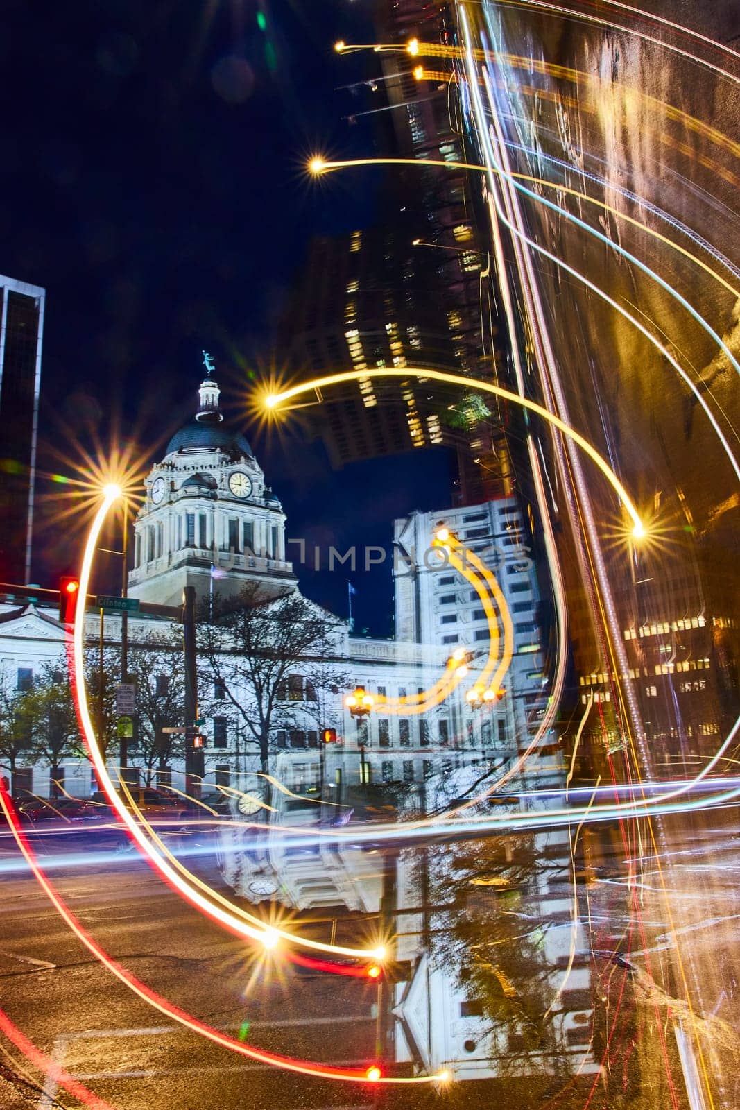 Abstract Art of Historic Fort Wayne courthouse shines amid modern city lights and dynamic nightlife.