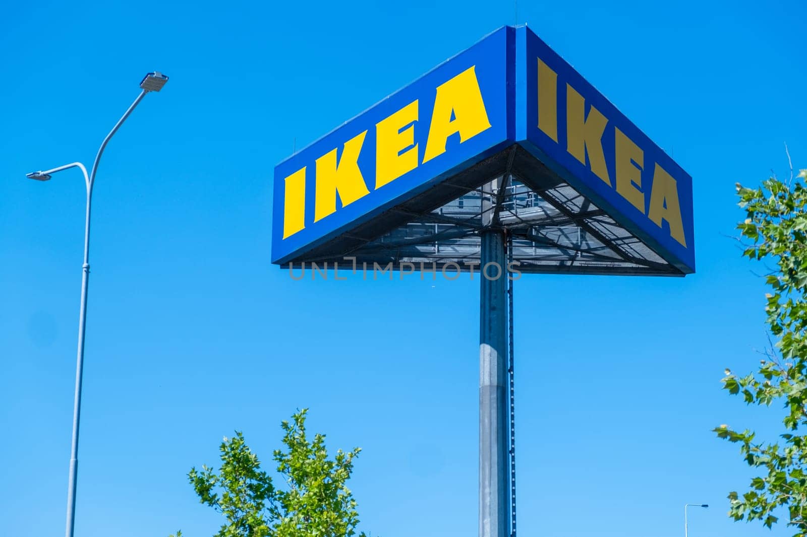 IKEA mass market signboard standing in the street. by vladimka