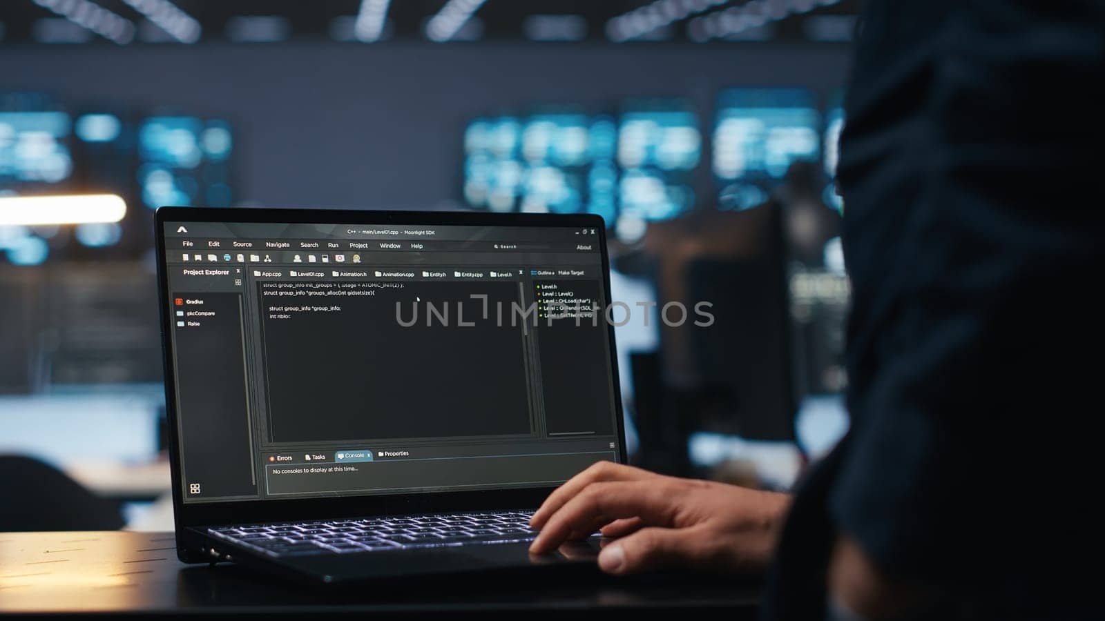 IT support employee typing on notebook keyboard to ensure optimal performance in data center. Close up shot of laptop used by worker monitoring energy consumption across servers