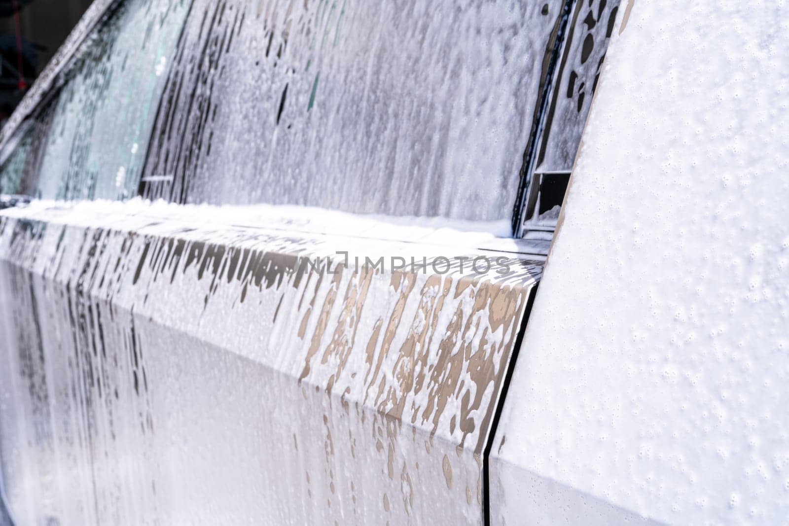 Soapy Water Streaming Down the Side of a Tesla Cybertruck by arinahabich